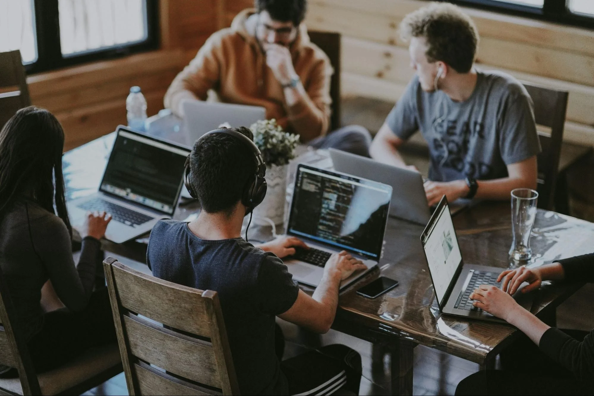 Group of professionals working on laptops